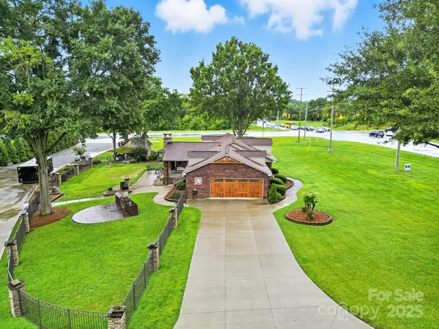 a view of yard with swimming pool and green space