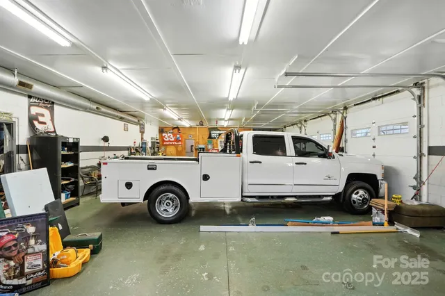 an aerial view of a house with swimming pool garden and patio