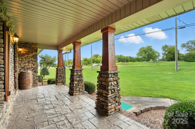 a front view of a building with a garden
