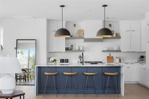 a kitchen with a table and chairs