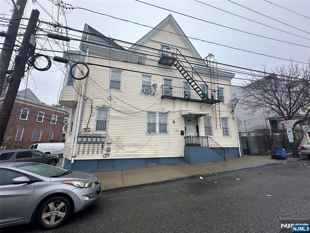 95-99 Lyon Street Paterson, NJ 07524 - Photo 1 of 3 a view of a car park in front of a building
