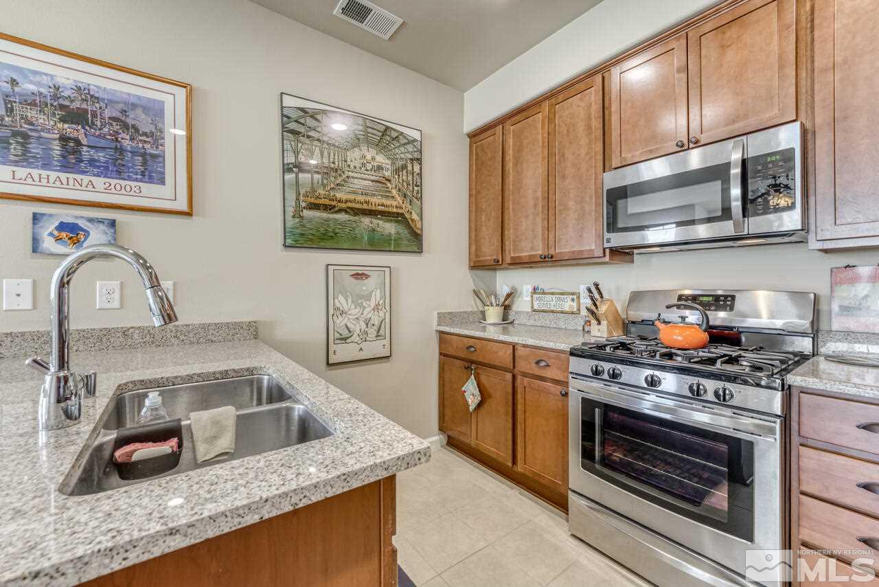 2490 Eastshore Place, Unit 208 Reno, NV 89509 - Photo 16 of 36 a kitchen with granite countertop a stove and a sink
