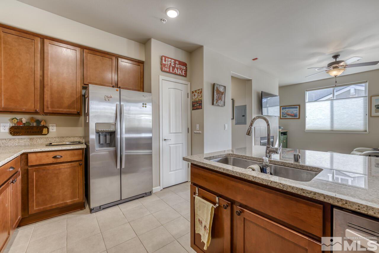 2490 Eastshore Place, Unit 208 Reno, NV 89509 - Photo 17 of 36 a kitchen with stainless steel appliances granite countertop a refrigerator and a sink