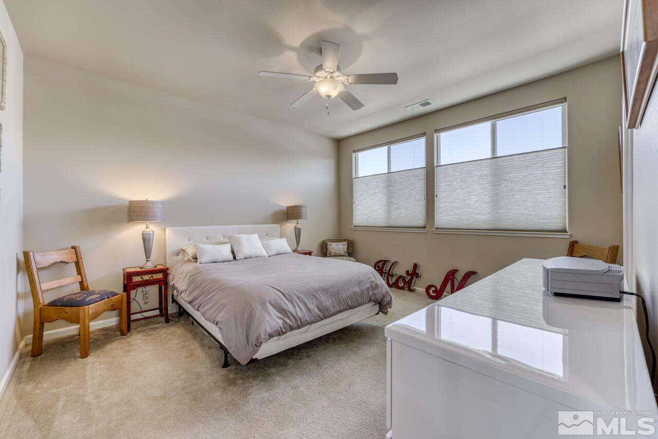 2490 Eastshore Place, Unit 208 Reno, NV 89509 - Photo 20 of 36 a bedroom with a bed and window