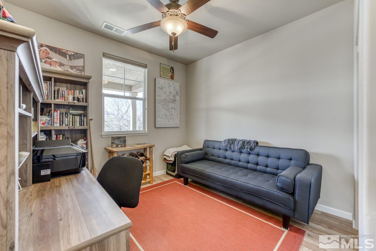 2490 Eastshore Place, Unit 208 Reno, NV 89509 - Photo 24 of 36 a living room with furniture and a flat screen tv