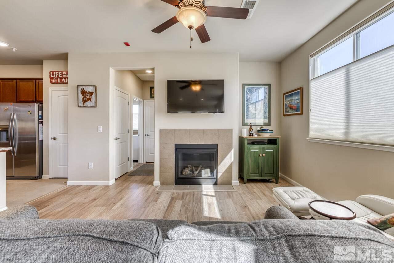 2490 Eastshore Place, Unit 208 Reno, NV 89509 - Photo 6 of 36 a living room with furniture and a fireplace