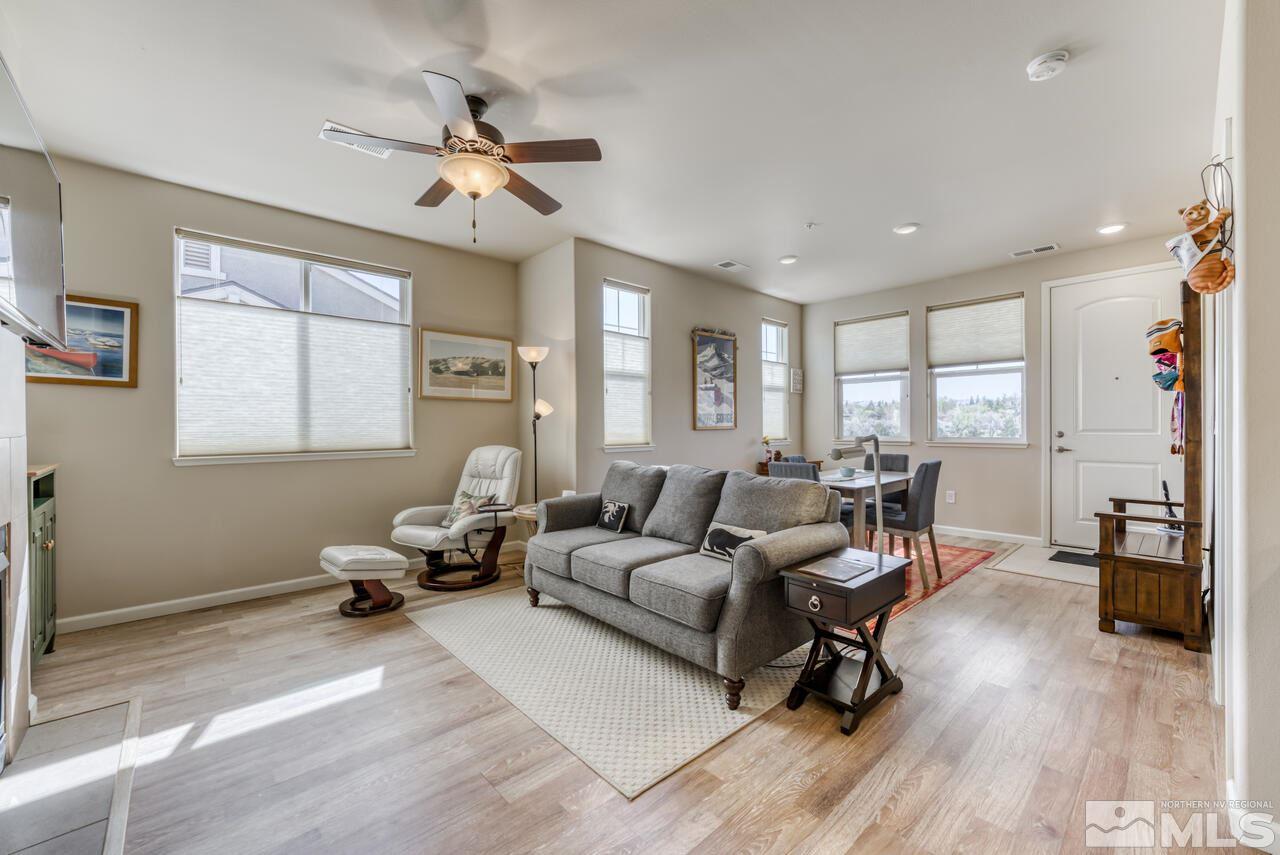 2490 Eastshore Place, Unit 208 Reno, NV 89509 - Photo 7 of 36 a living room with furniture and wooden floor