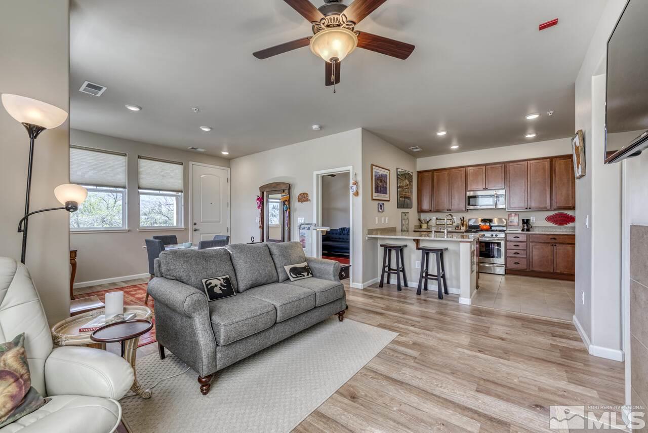 2490 Eastshore Place, Unit 208 Reno, NV 89509 - Photo 8 of 36 a living room with furniture and kitchen view