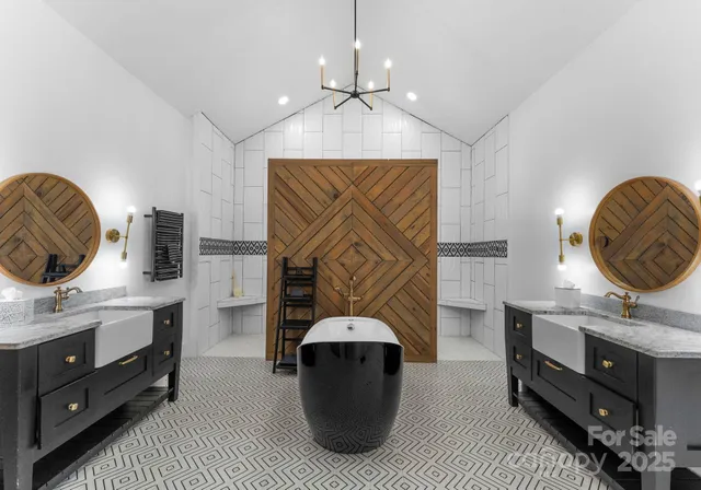 a spacious bedroom with a bed dresser and a window