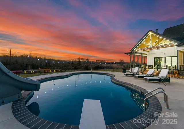 a view of swimming pool from a balcony