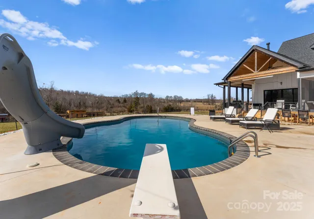 a view of a patio with swimming pool