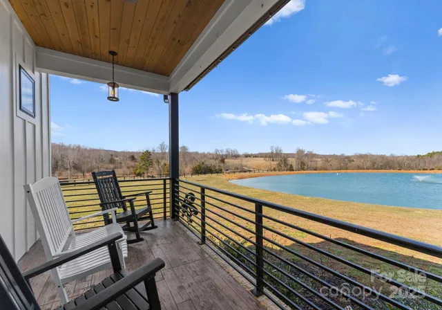 a view of a balcony with chairs