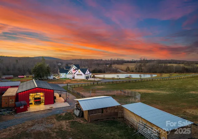 a view of swimming pool with outdoor seating and lake