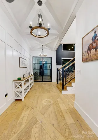 a view of kitchen with furniture and chandelier