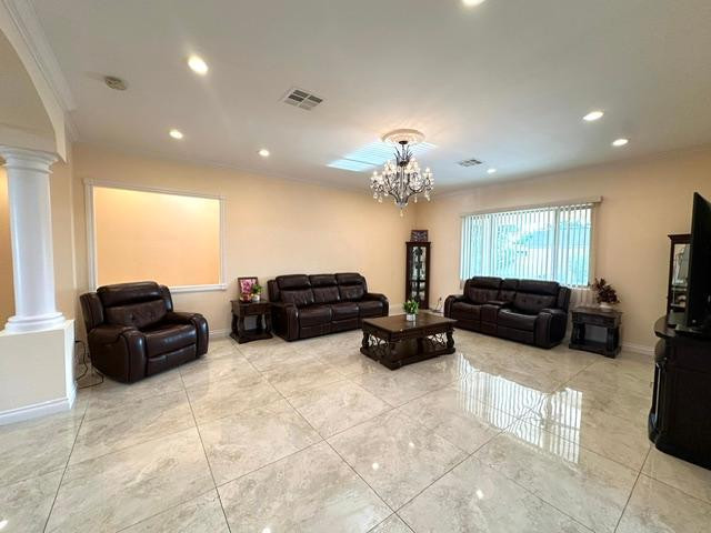 6830 North 14th Street Phoenix, AZ 85014 - Photo 26 of 28 a living room with furniture and a flat screen tv