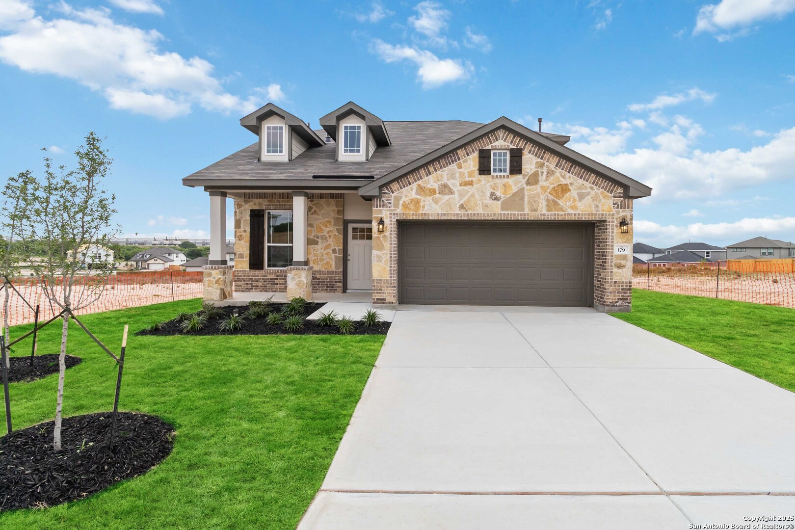 179 Ashley Loop San Antonio, TX 78253 - Photo 1 of 1 a front view of a house with garden