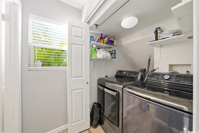 a kitchen with a stove and a window