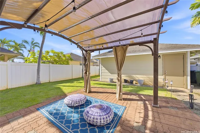 a view of a patio with table and chairs potted plants with wooden floor
