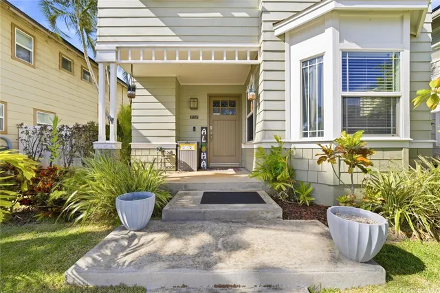 a view of a porch with potted plants