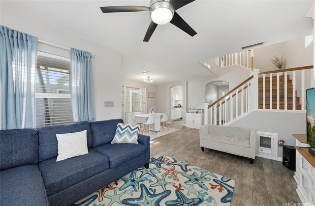 a living room with furniture and a large window