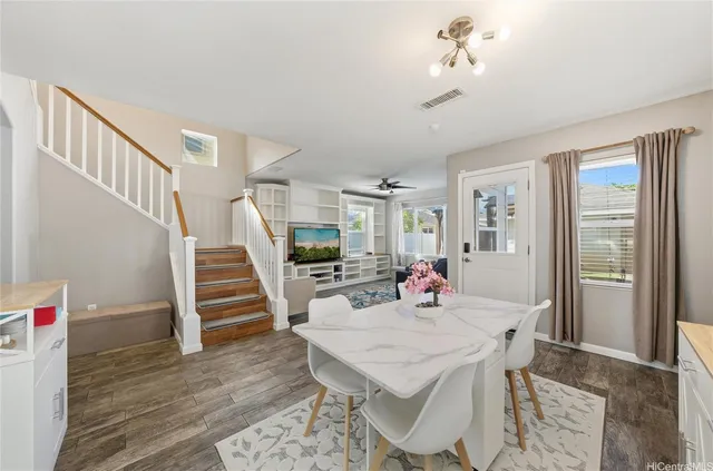 a view of a dining room with furniture window and wooden floor