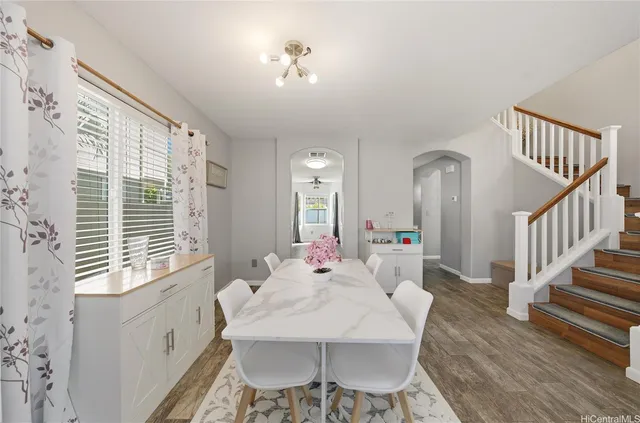 a dining room with furniture and window