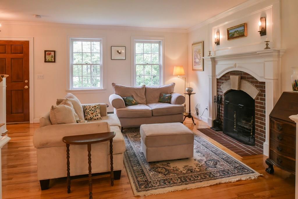 153 Kimball Road Amesbury, MA 01913 - Photo 3 of 17 a living room with furniture and a fireplace