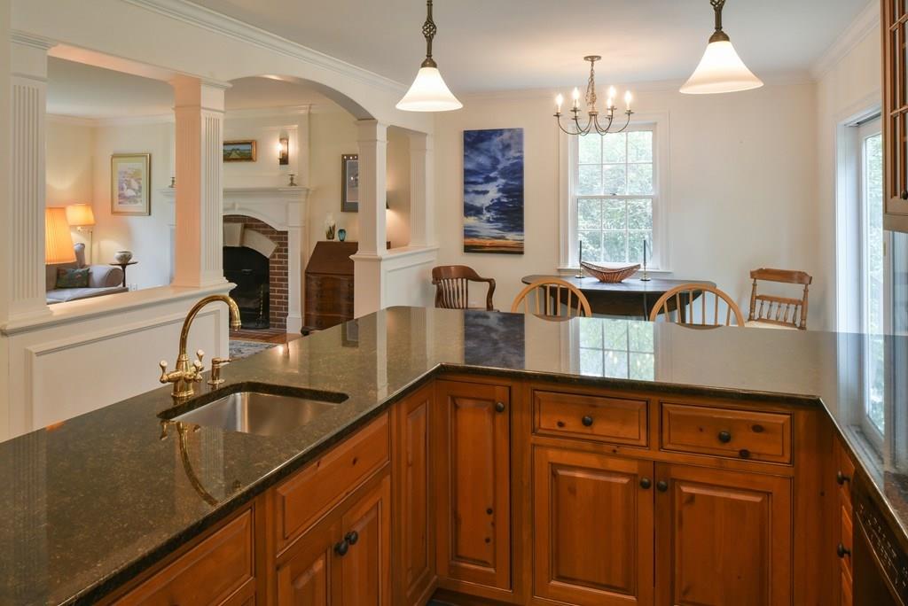 153 Kimball Road Amesbury, MA 01913 - Photo 8 of 17 a kitchen with sink cabinets and window