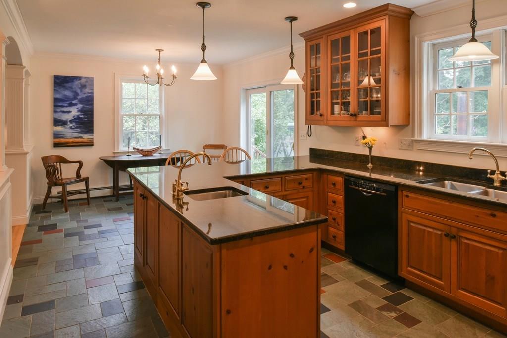 153 Kimball Road Amesbury, MA 01913 - Photo 10 of 17 a kitchen with a sink stove and cabinets