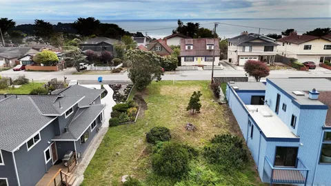 an aerial view of a house with swimming pool