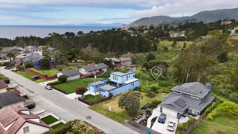 an aerial view of a house with a garden