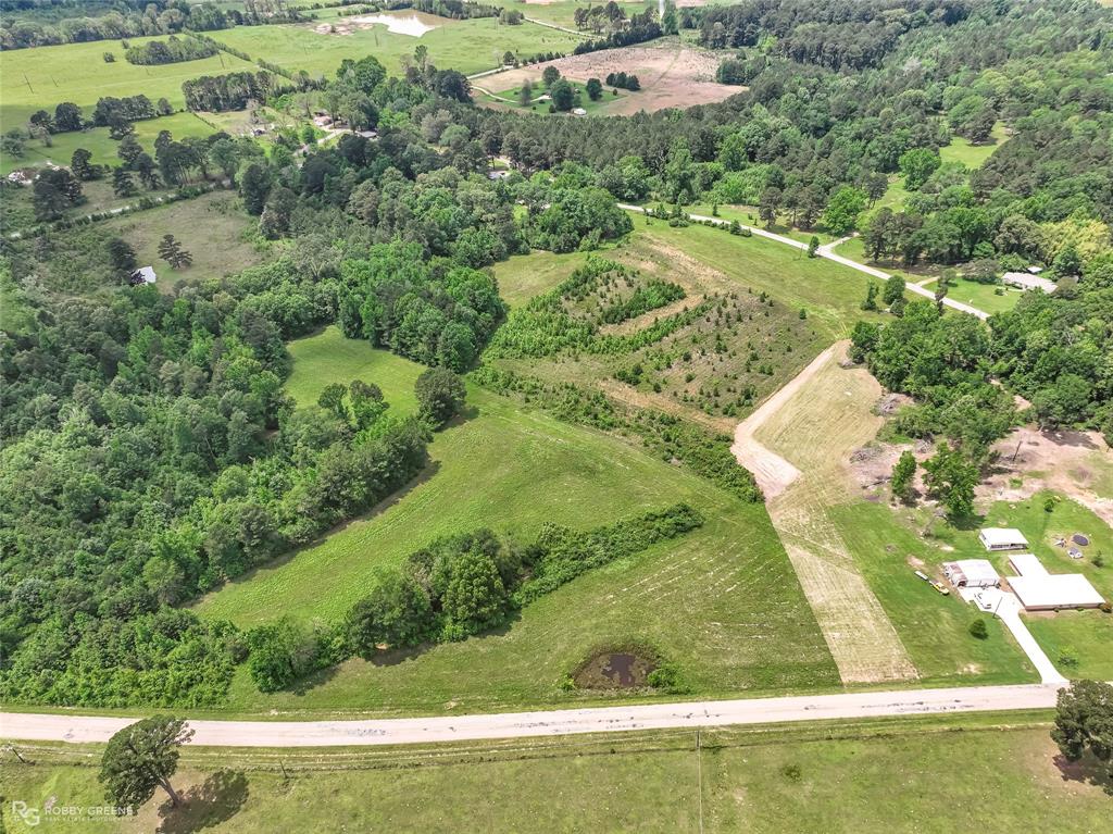 0 Percy Burns Road Springhill, LA 71075 - Photo 5 of 7 an aerial view of residential houses with outdoor space and trees