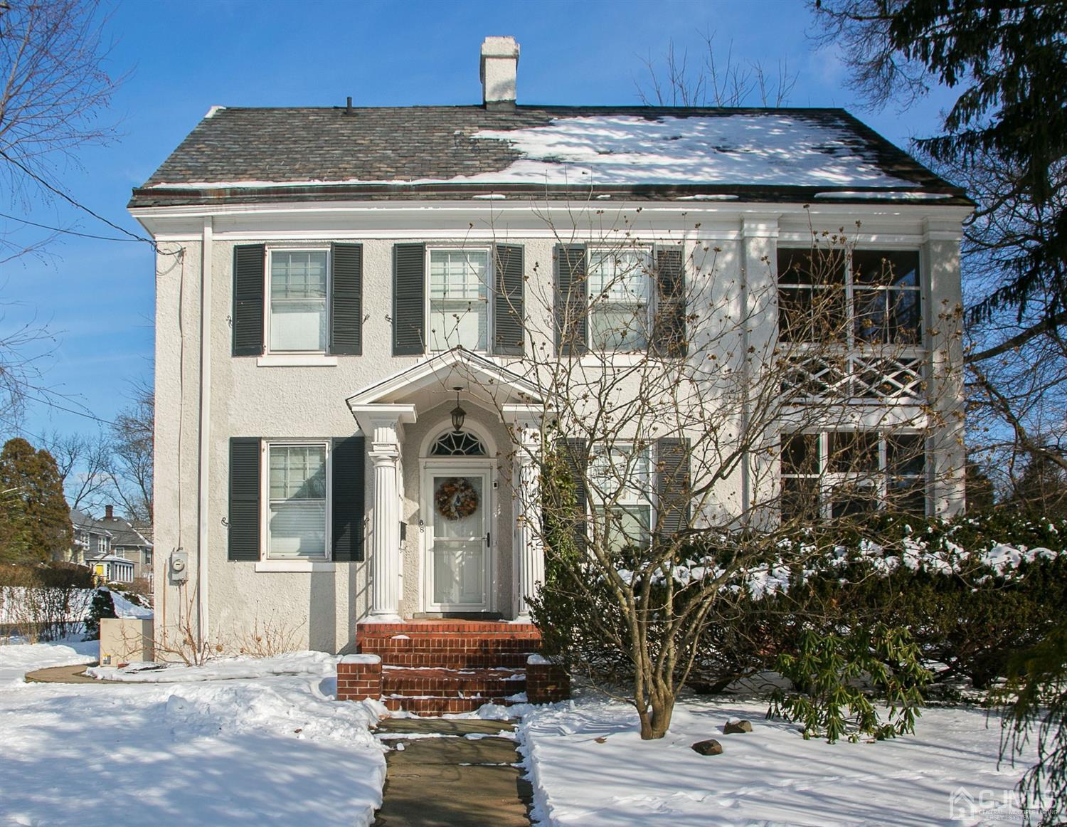 68 Rector Street Metuchen, NJ 08840 - Photo 1 of 40 a view of a brick house with many windows