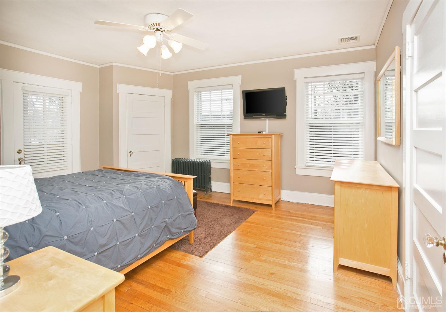68 Rector Street Metuchen, NJ 08840 - Photo 22 of 40 a bedroom with a bed and a flat screen tv
