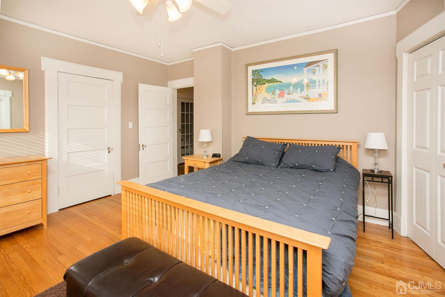 68 Rector Street Metuchen, NJ 08840 - Photo 23 of 40 a bedroom with a bed and wooden floor