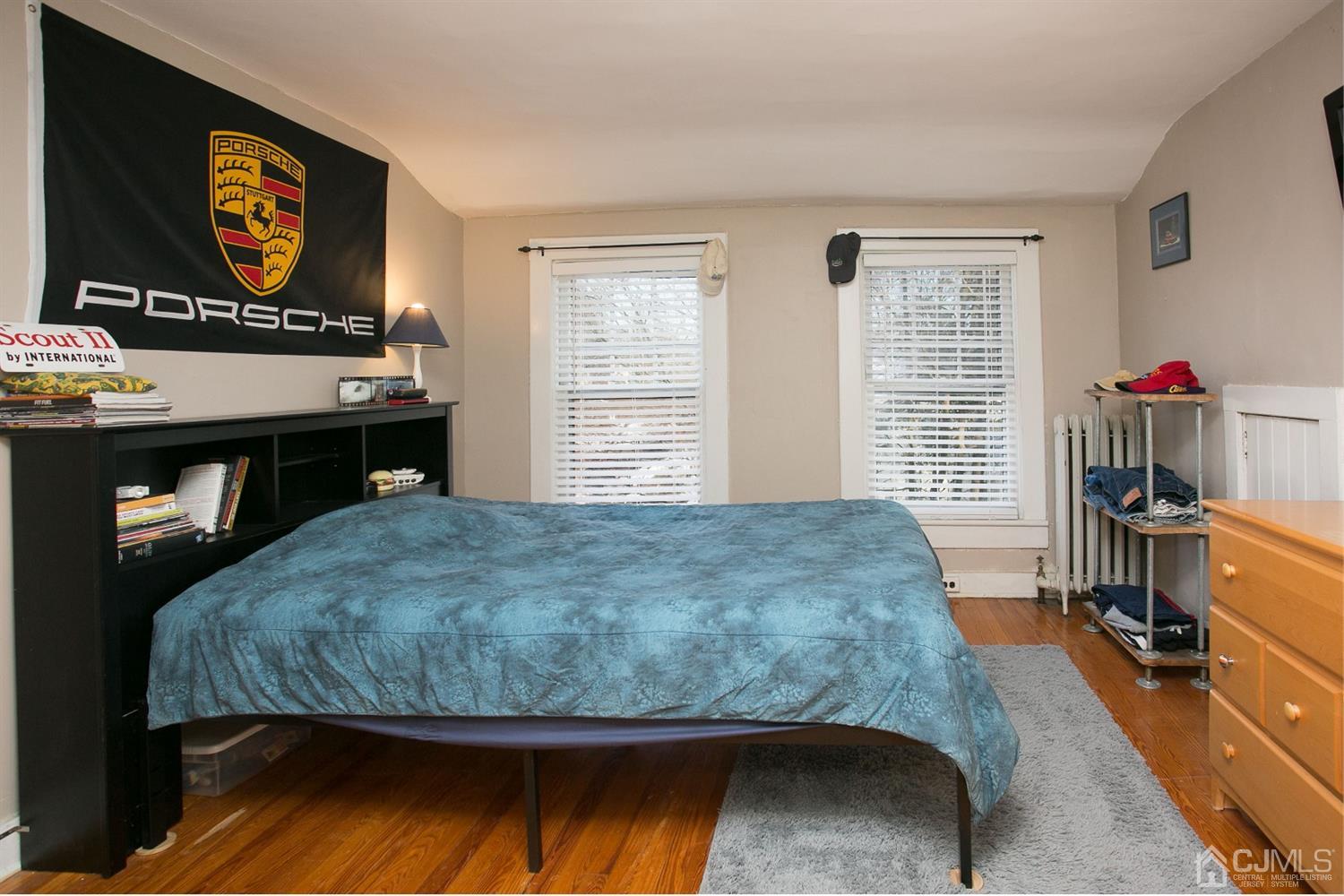 68 Rector Street Metuchen, NJ 08840 - Photo 31 of 40 a bed sitting in a bedroom next to a window