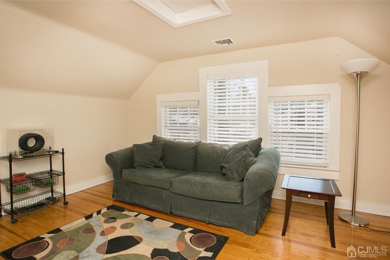 68 Rector Street Metuchen, NJ 08840 - Photo 33 of 40 a living room with furniture and a window