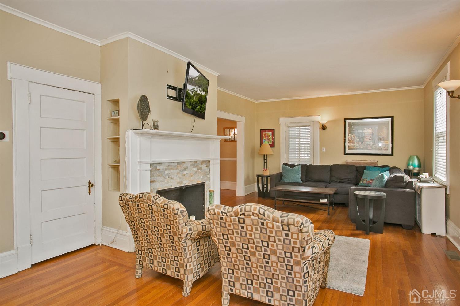 68 Rector Street Metuchen, NJ 08840 - Photo 8 of 40 a living room with furniture and a fireplace