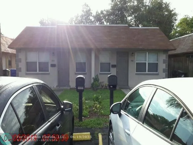 a view of backyard with swimming pool and outdoor seating