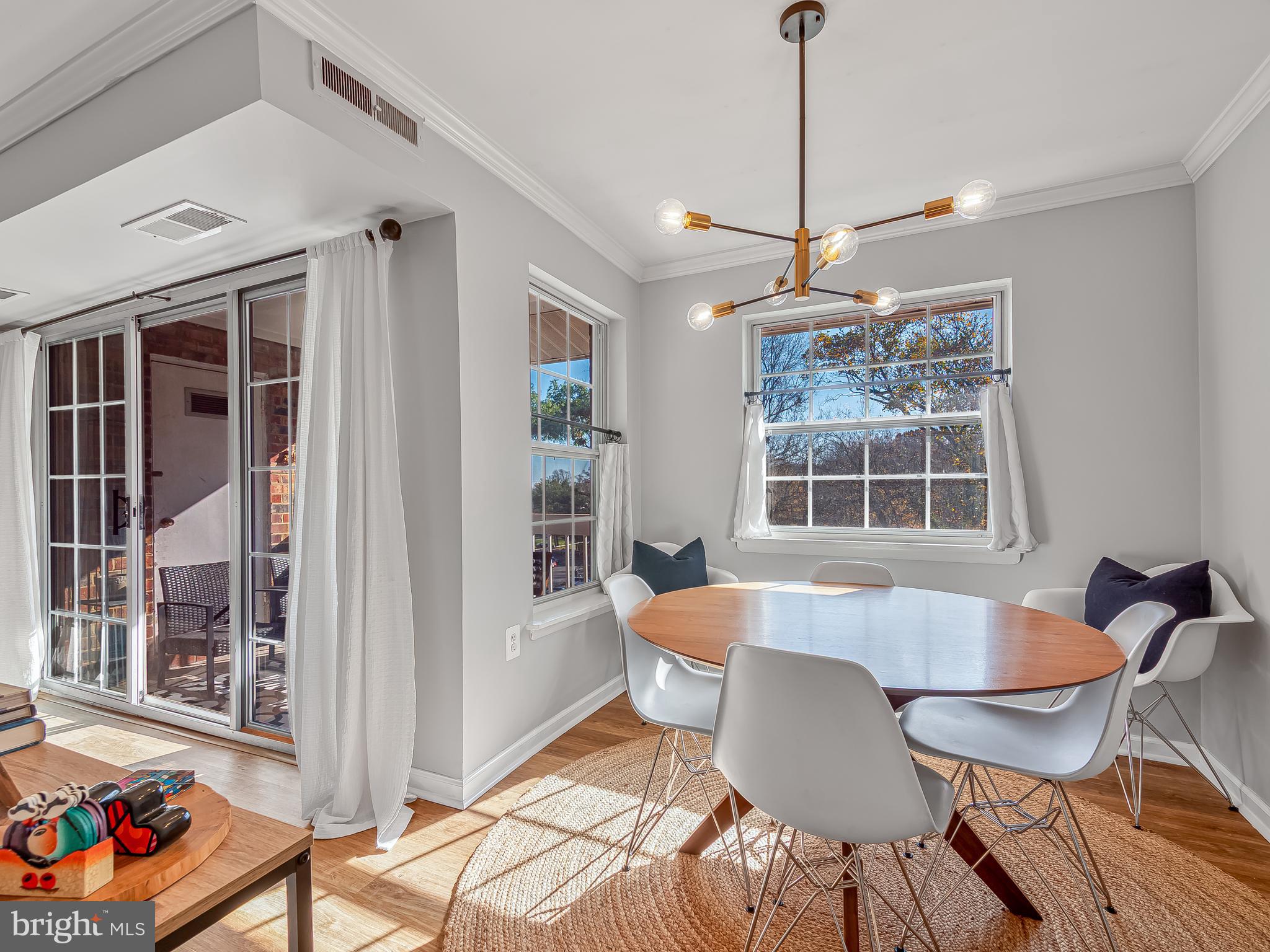 1914 Wilson Lane, Unit 202 McLean, VA 22102 - Photo 16 of 42 a view of a dining room with furniture window and outside view