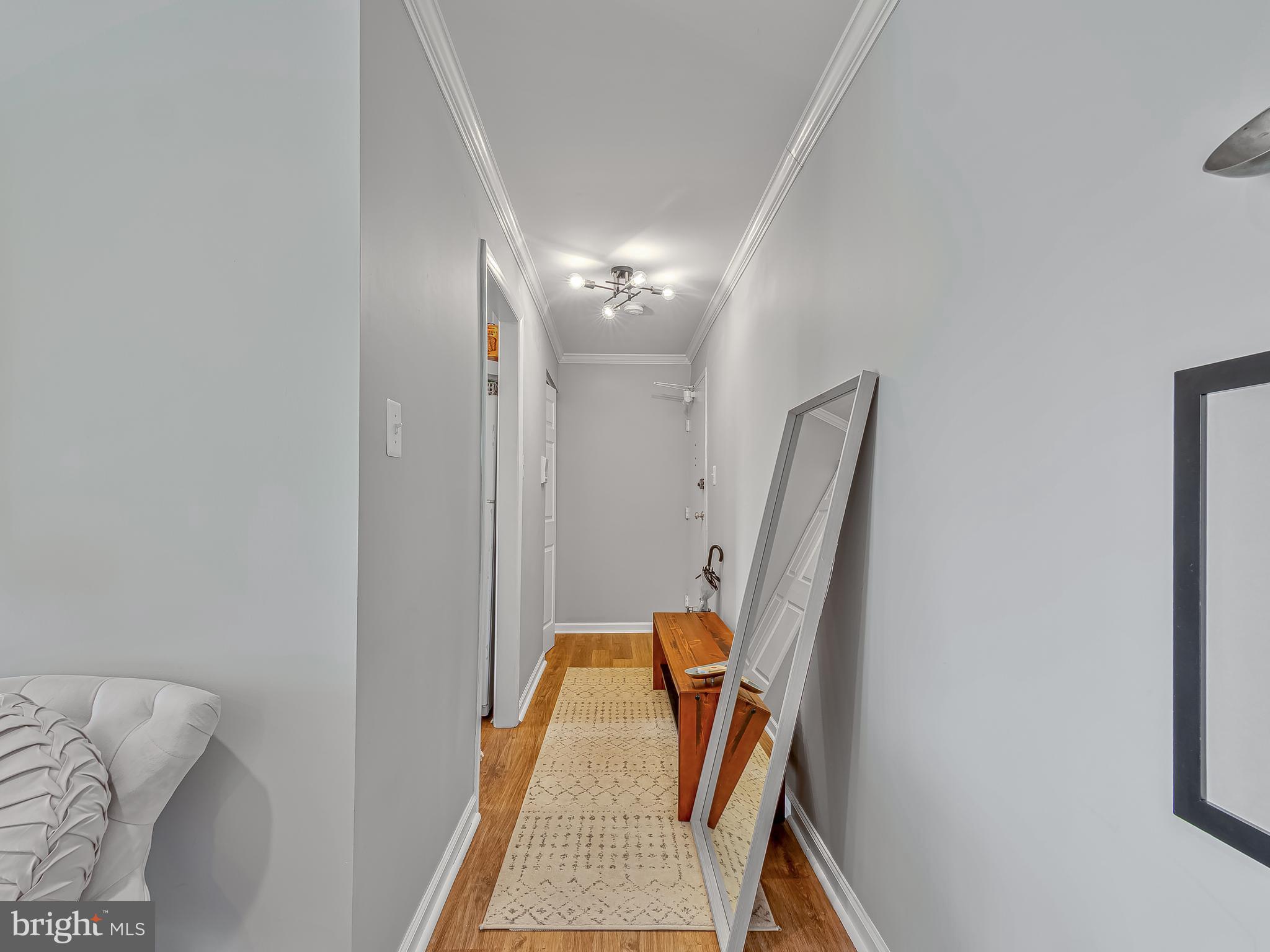 1914 Wilson Lane, Unit 202 McLean, VA 22102 - Photo 19 of 42 a view of living room with furniture and a chandelier