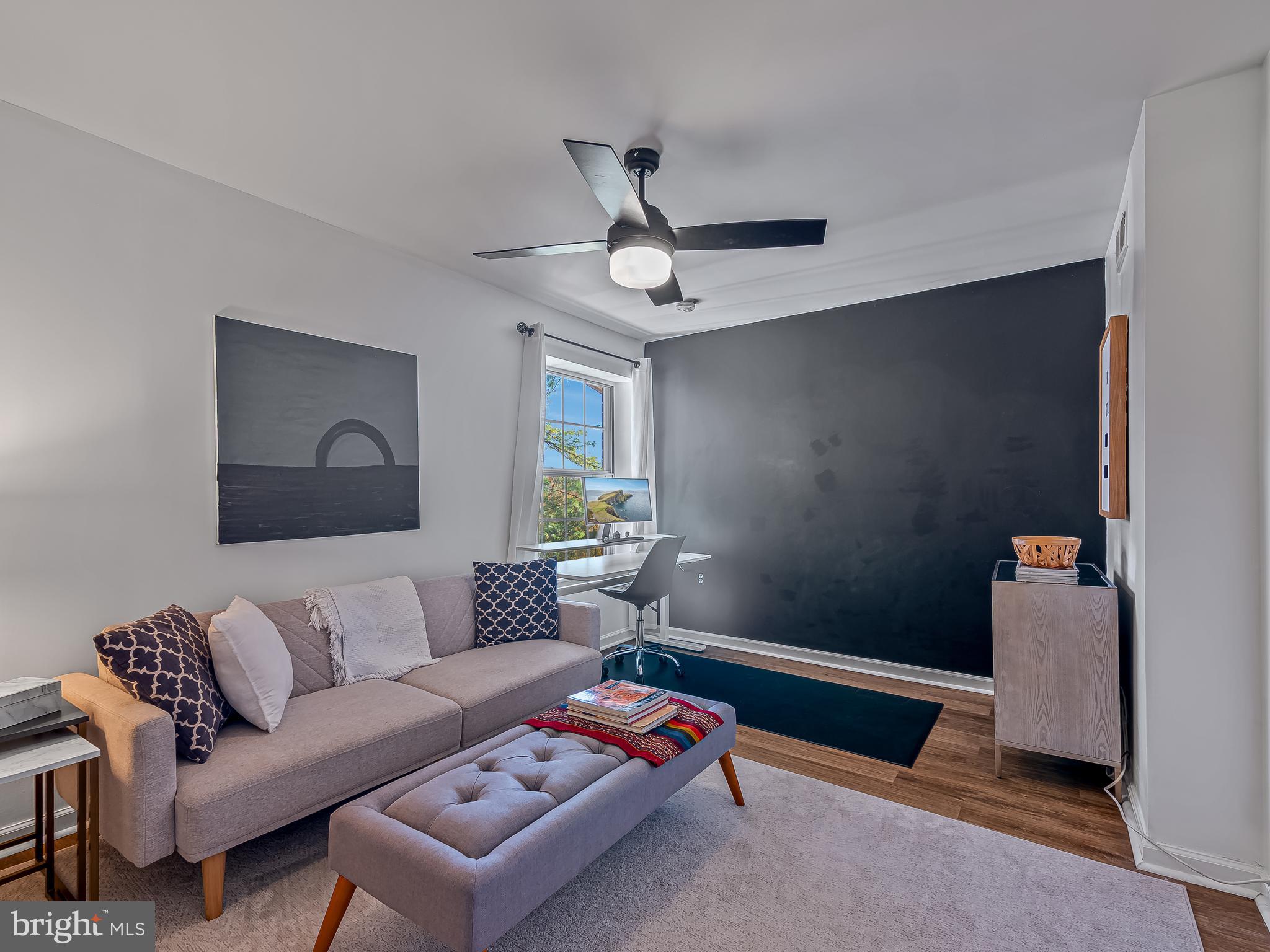 1914 Wilson Lane, Unit 202 McLean, VA 22102 - Photo 22 of 42 a living room with furniture and a ceiling fan