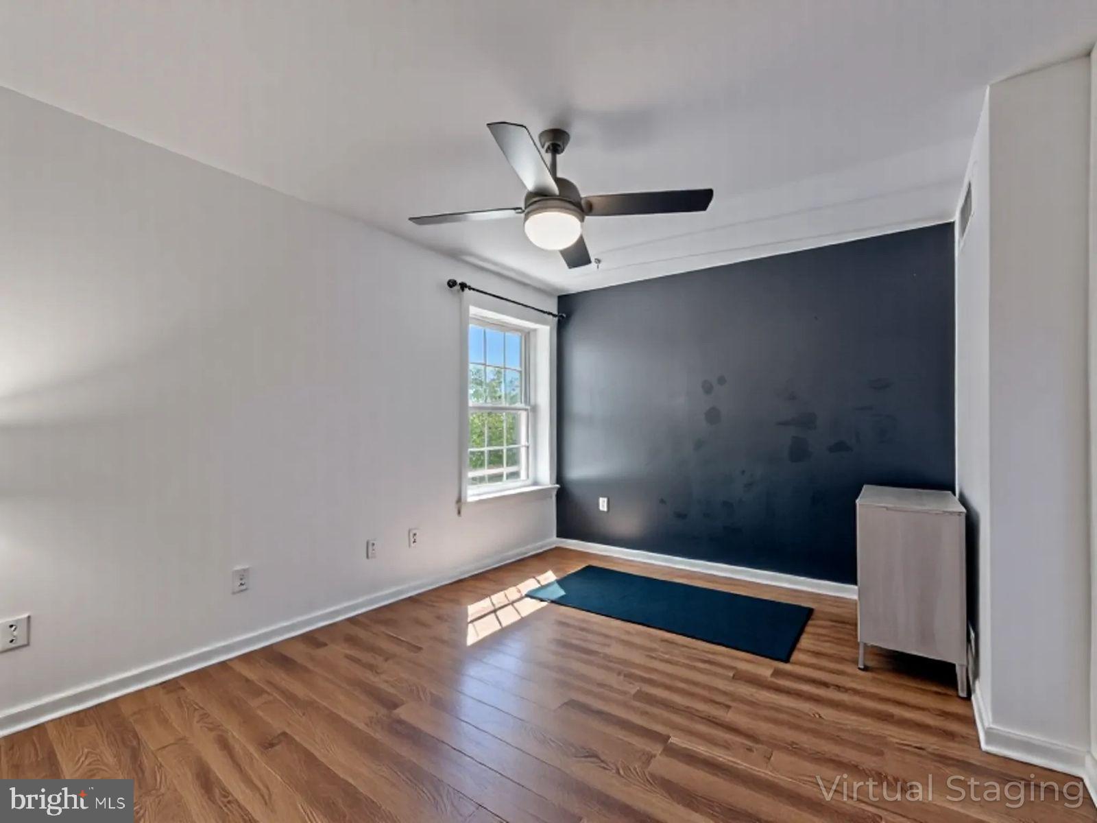 1914 Wilson Lane, Unit 202 McLean, VA 22102 - Photo 23 of 42 wooden floor in an empty room with a window