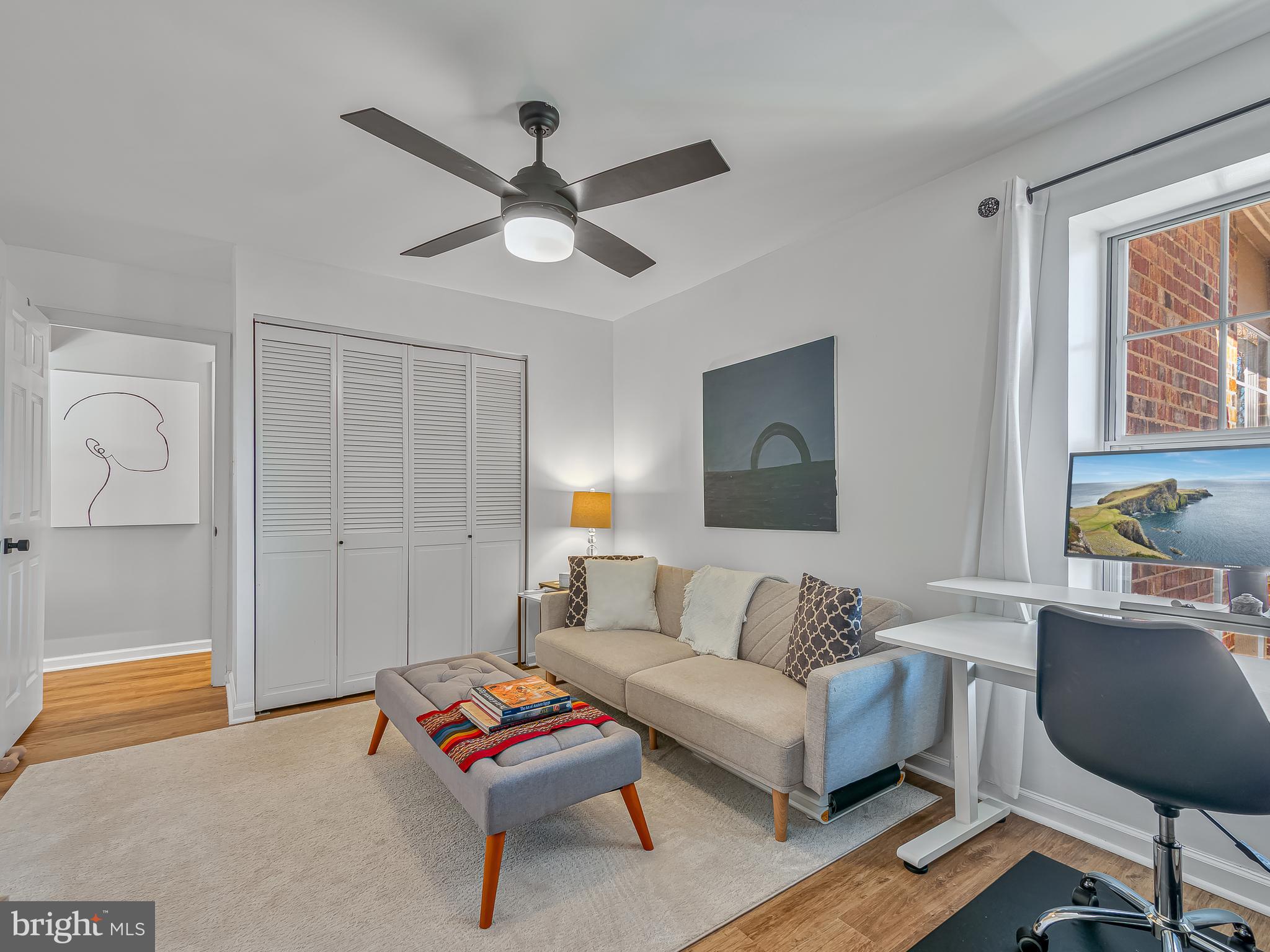 1914 Wilson Lane, Unit 202 McLean, VA 22102 - Photo 30 of 42 a living room with furniture and a ceiling fan