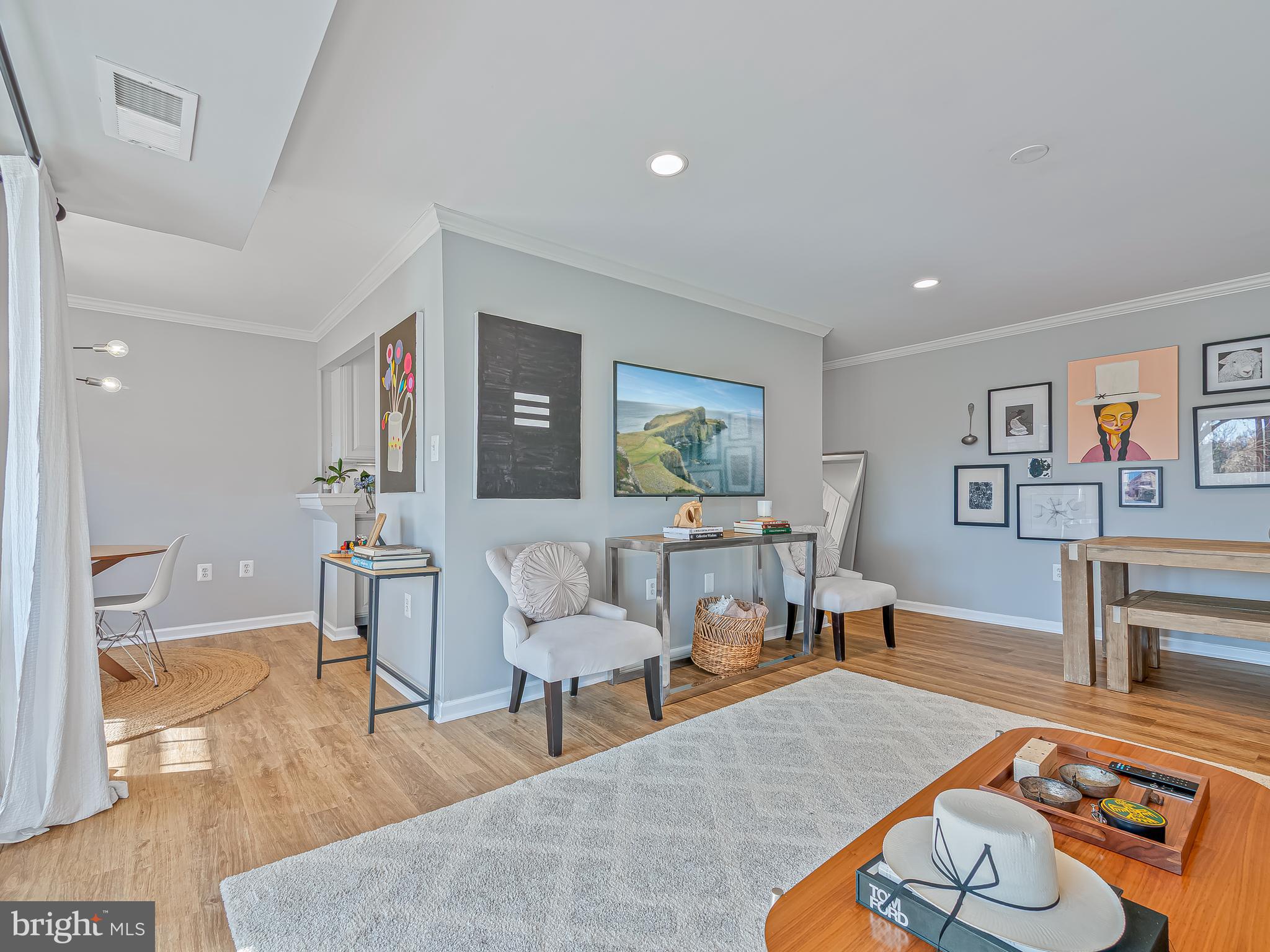 1914 Wilson Lane, Unit 202 McLean, VA 22102 - Photo 8 of 42 a living room with furniture and a table
