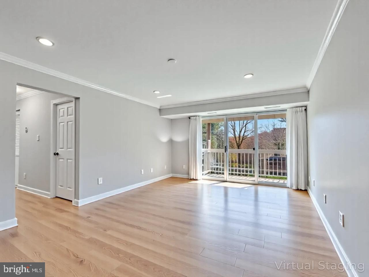 1914 Wilson Lane, Unit 202 McLean, VA 22102 - Photo 10 of 42 wooden floor in an empty room with a window
