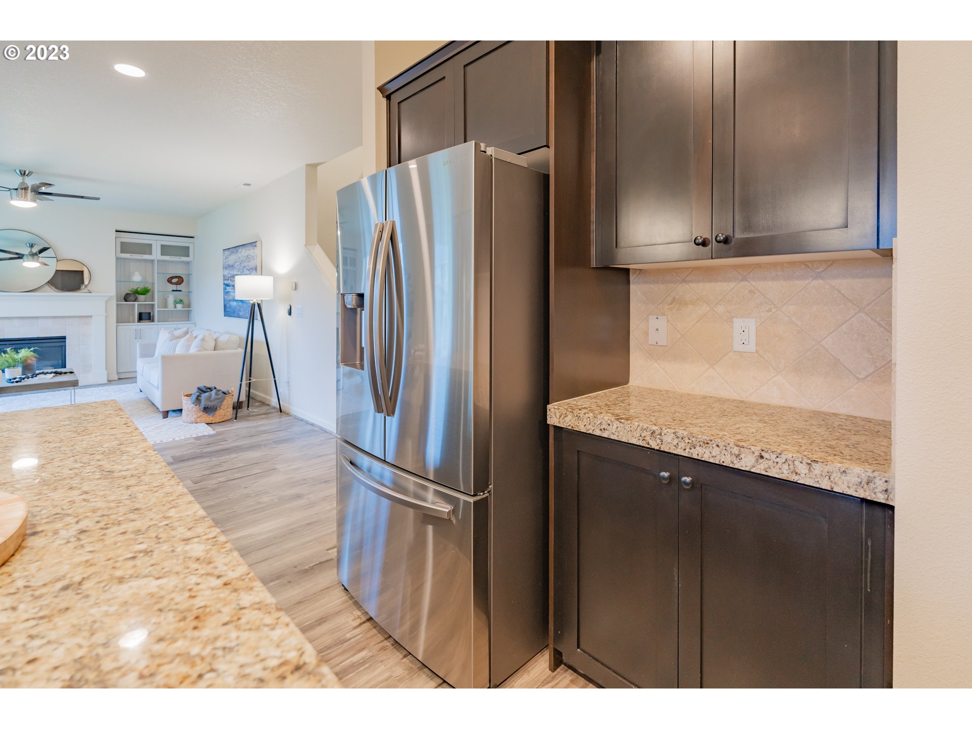 364 North Green Gables Loop Ridgefield, WA 98642 - Photo 11 of 32 a kitchen with stainless steel appliances granite countertop a refrigerator and a sink