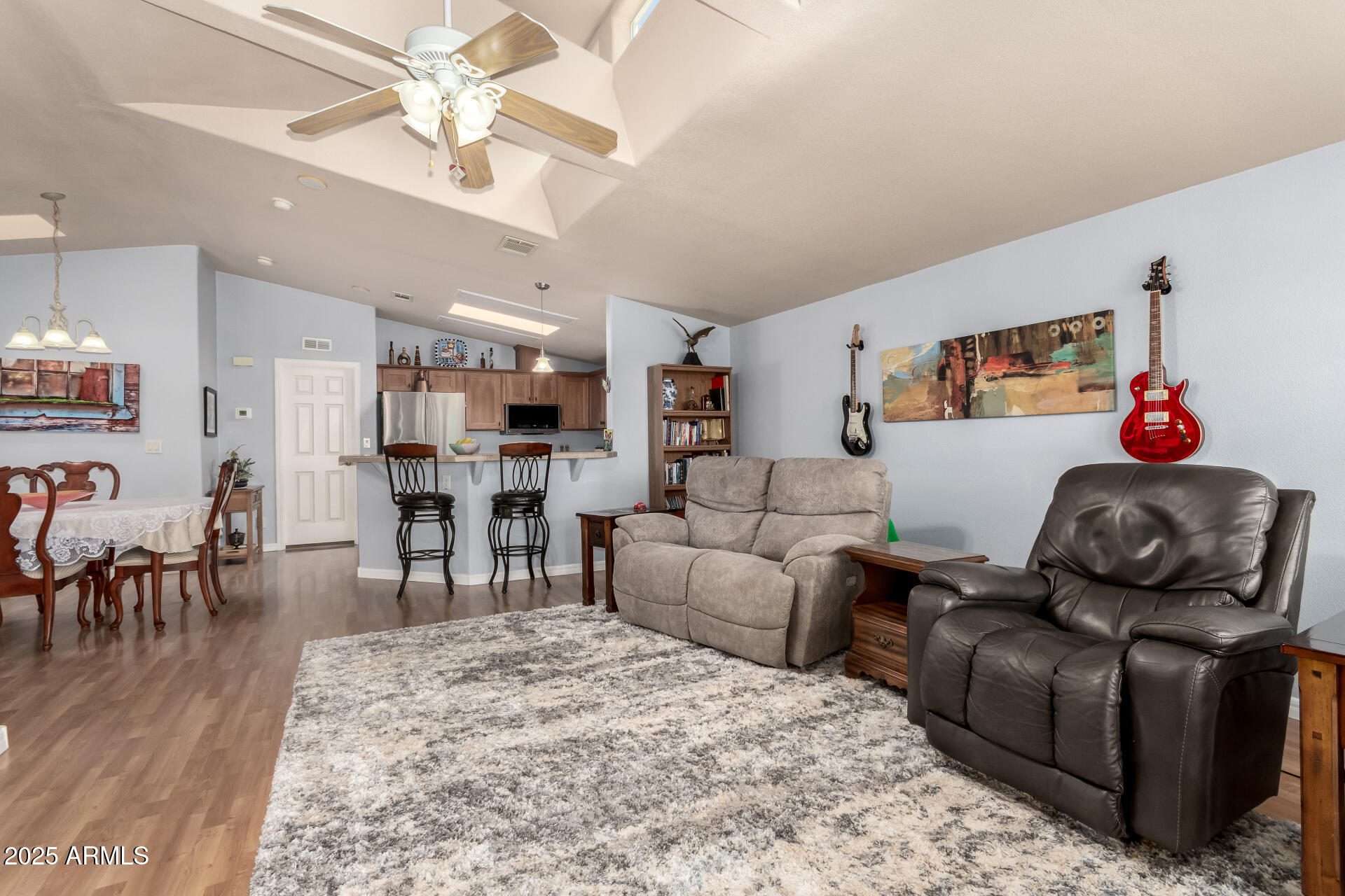 3301 South Goldfield Road, Unit 2122 Apache Junction, AZ 85119 - Photo 14 of 35 a living room with furniture and wooden floor