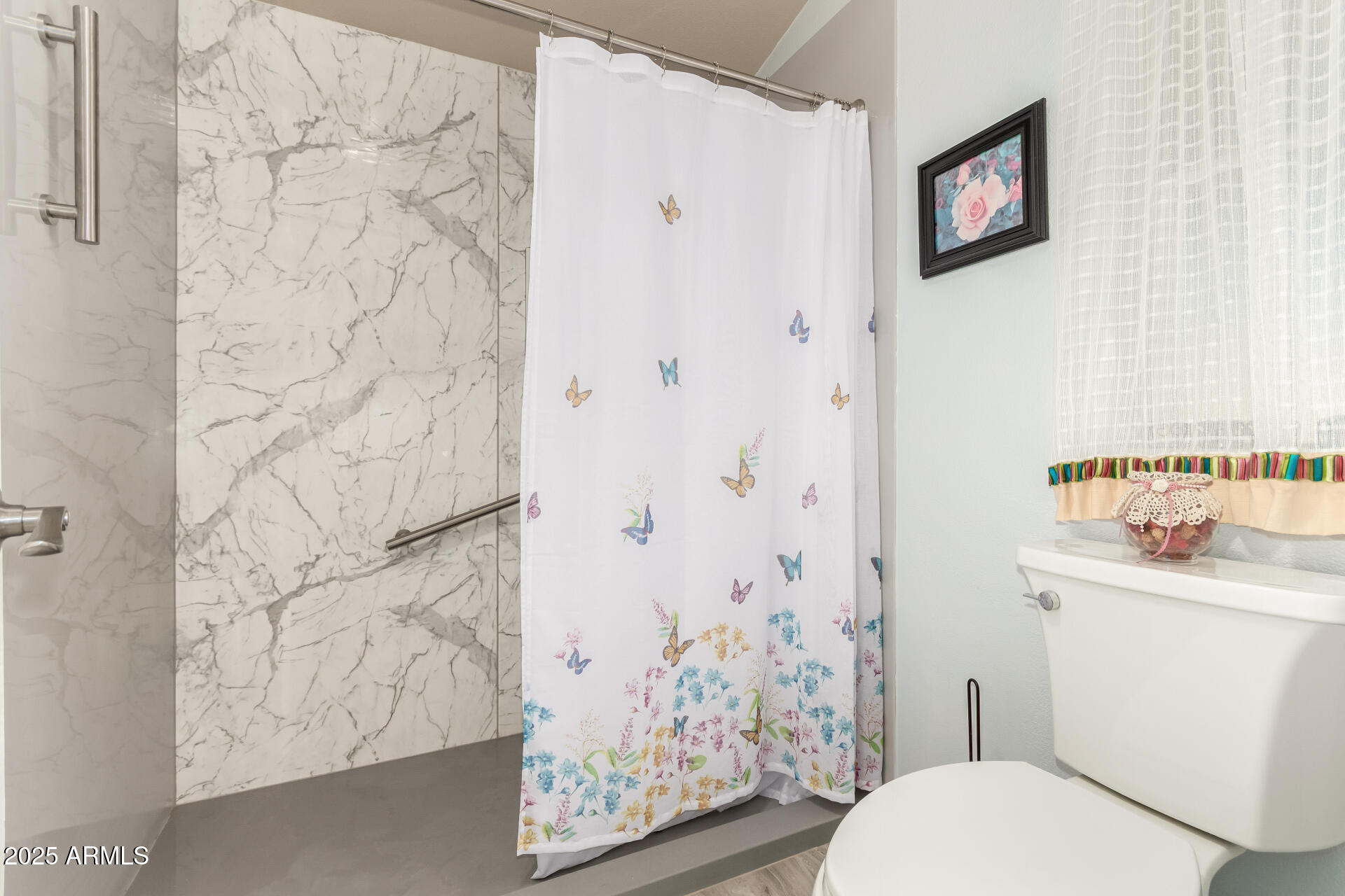 3301 South Goldfield Road, Unit 2122 Apache Junction, AZ 85119 - Photo 21 of 35 a white toilet sitting next to a bathroom sink