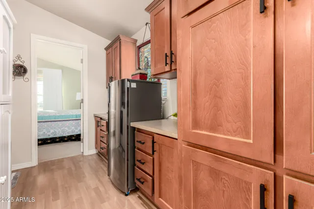 a kitchen with stainless steel appliances a refrigerator and a stove